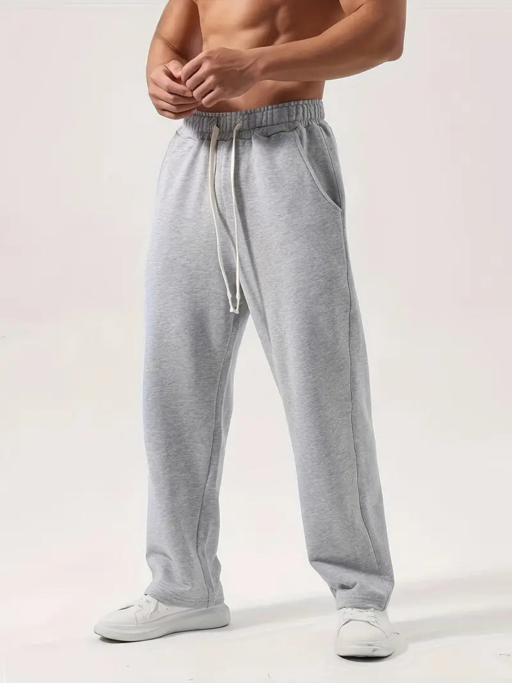 Men's casually fitting sweatpants made of cotton blend with elastic waistband and side pockets Mune Fashion