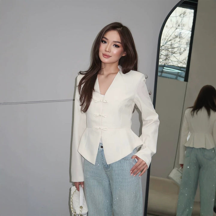 Women's peplum blazer with mandarin-like neckline and decorative knot fastenings Mune Fashion