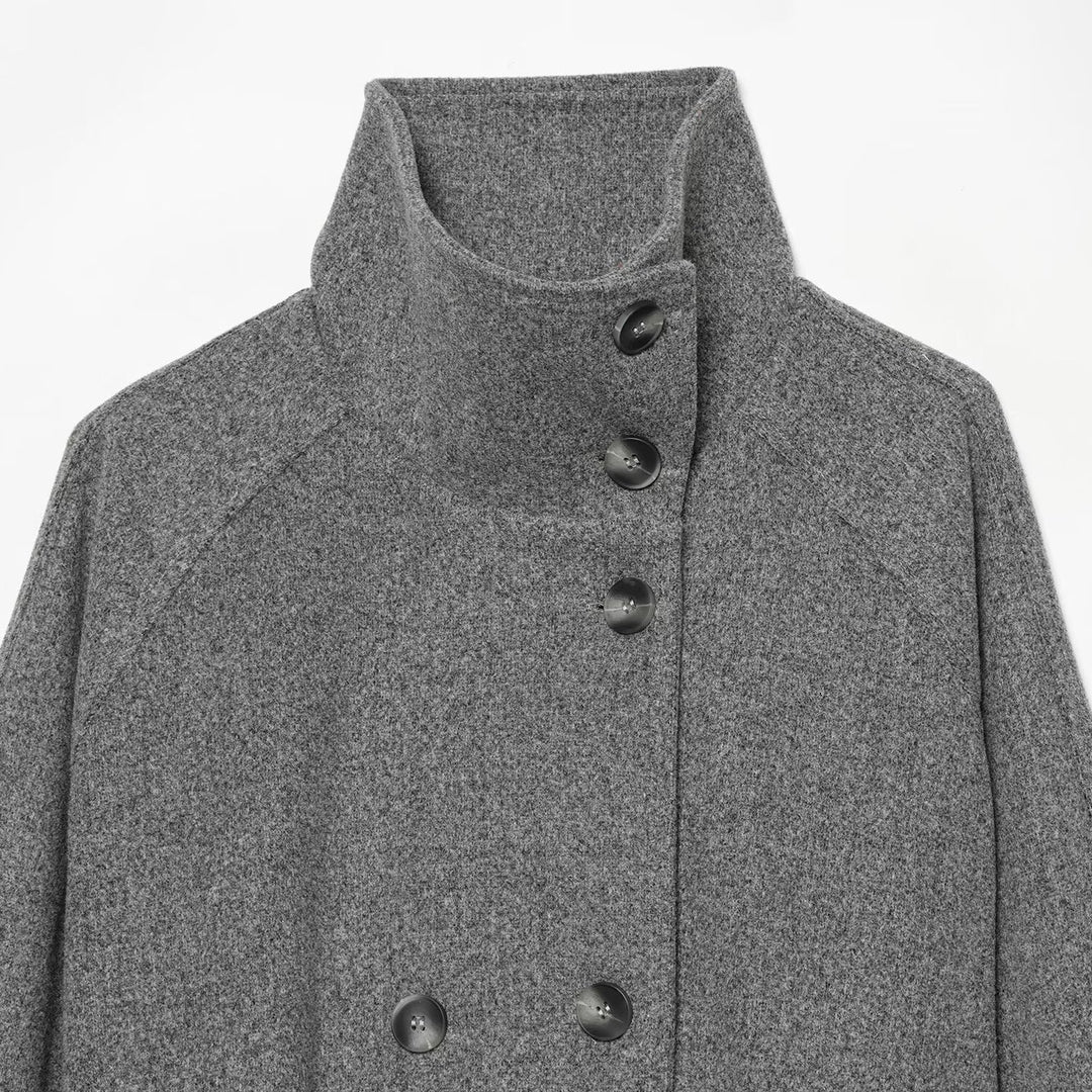 Women's cape transitional jacket in a short cut with a high collar, double button placket, and waist tie belt Mune Fashion