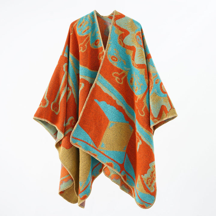 Women's statement cape poncho made from jacquard woven wool blend with skull and bone pattern Mune Fashion