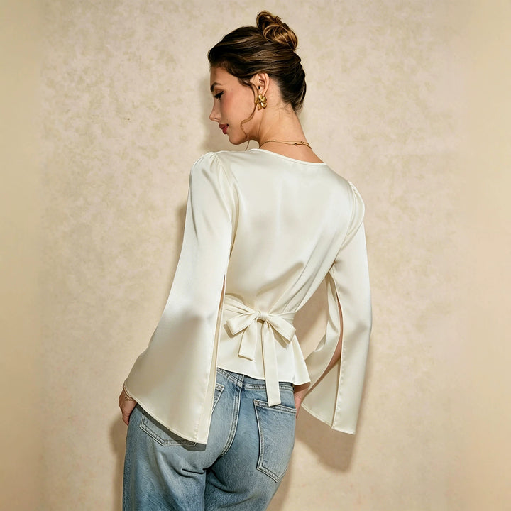 Women's elegant satin blouse with waterfall neckline, tailored silhouette and long sleeve slits.