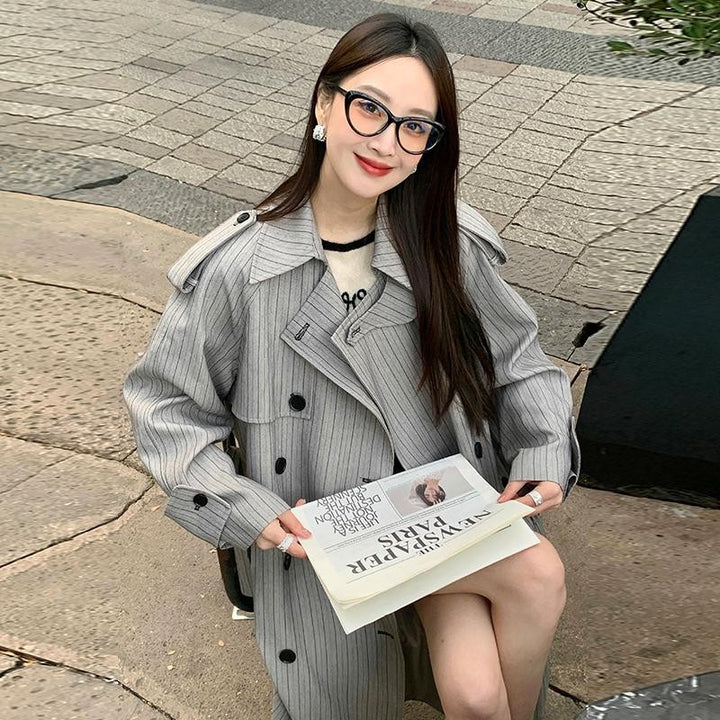 Women’s Long Pinstripe Trench Coat with Tie Belt Shoulder Straps and Flared Hem Mune Fashion