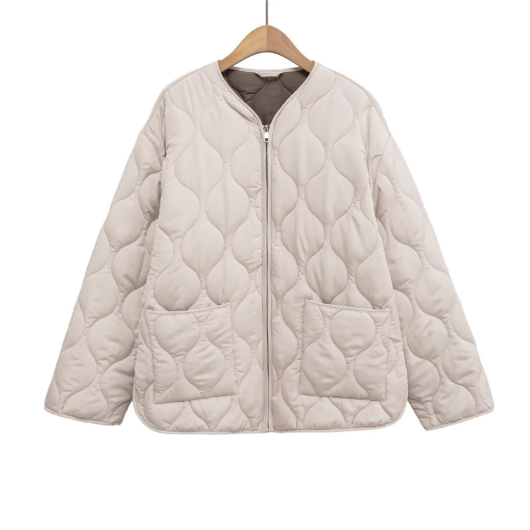Women's non-quilted oversized quilted jacket with round neckline, full-length zipper, and patch pockets Mune Fashion