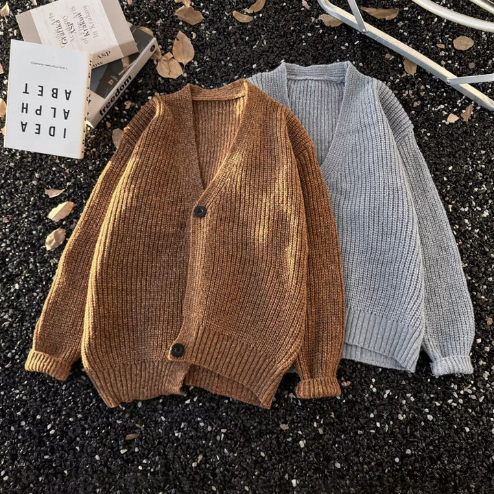 Unisex chunky knit cardigan in oversized cut with deep V-neck and distinctive button placket Mune Fashion