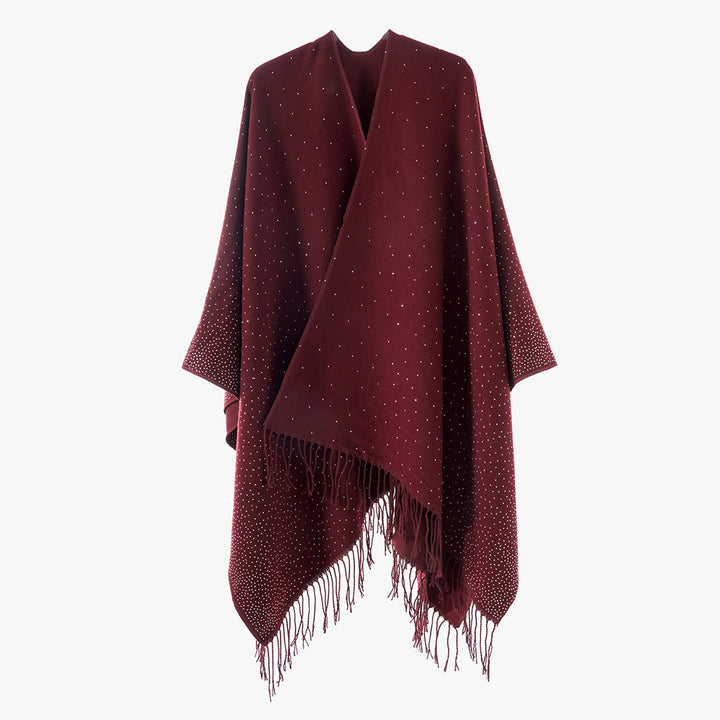 Women’s knitted poncho with fringes and subtle shimmer embellishment Mune Fashion