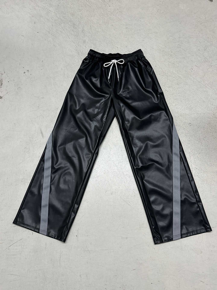 Ladies wide faux leather track pants with elastic waistband, drawstring and side stripes Mune Fashion
