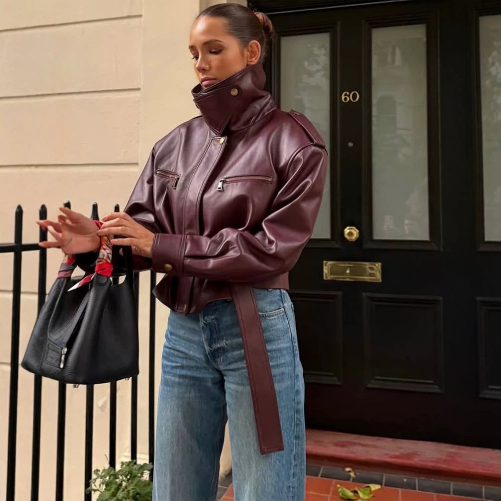 Women's fitted faux leather bomber jacket with high stand collar and tie belt Mune Fashion