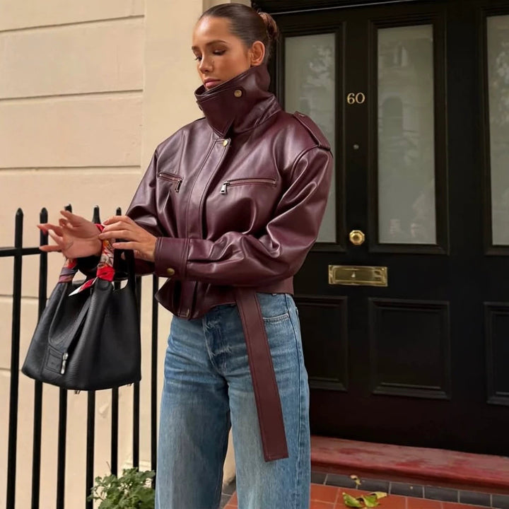Women's fitted faux leather bomber jacket with high stand collar and tie belt Mune Fashion