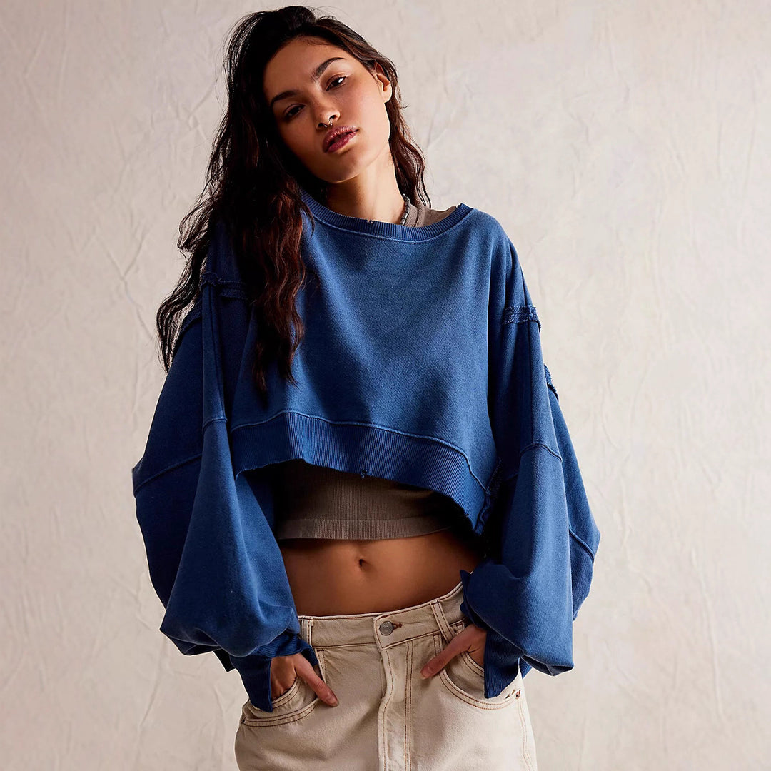 Women's cropped oversized sweatshirt with thumb hole, frayed hem, and wide raglan sleeves Mune Fashion