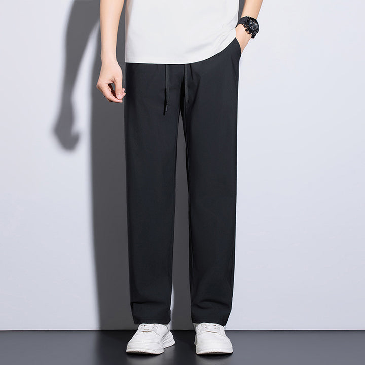 Men's sporty training pants with elastic waistband and practical pockets Mune Fashion