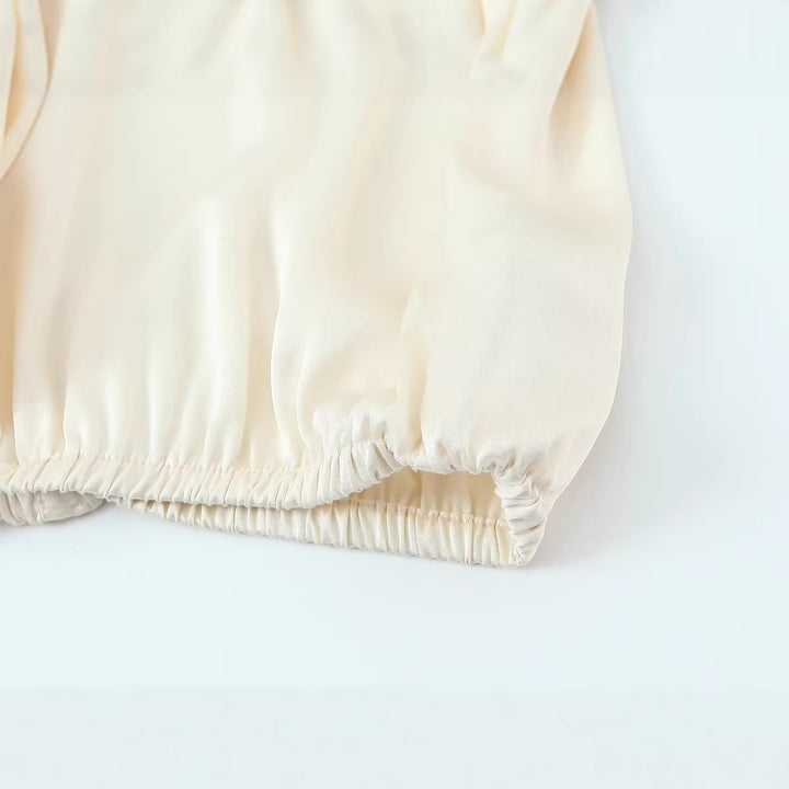 Women's satin blouse with deep wrap V-neck, elastic hem, and balloon sleeves Mune Fashion