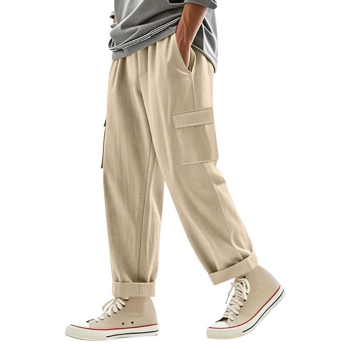 Men's wide cargo pants with flap pockets, elastic comfort waistband, and turned-up hem Mune Fashion