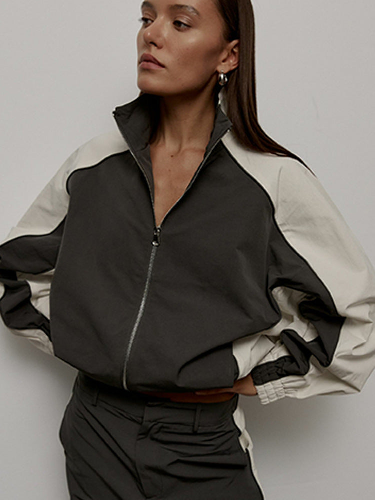 Women's oversized sporty track jacket with high stand-up collar and raglan sleeves Mune Fashion