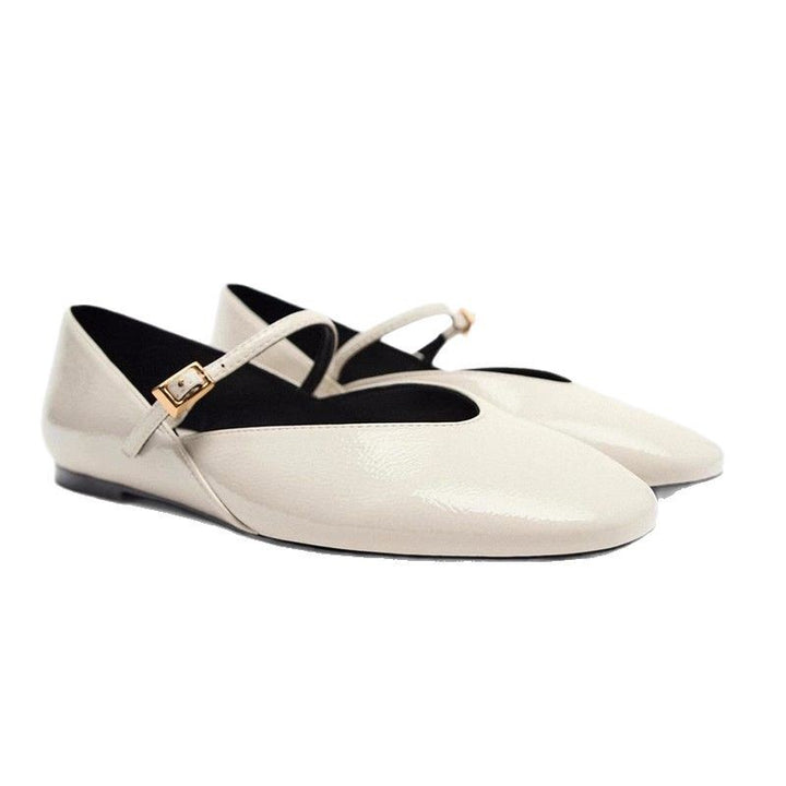 Women's elegant patent leather Mary Jane ballerina flats with a fine metal buckle and pointed toe cap.