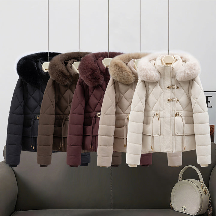 Women's short quilted hooded jacket with voluminous faux fur trim, drawstring waist, and flap pockets Mune Fashion