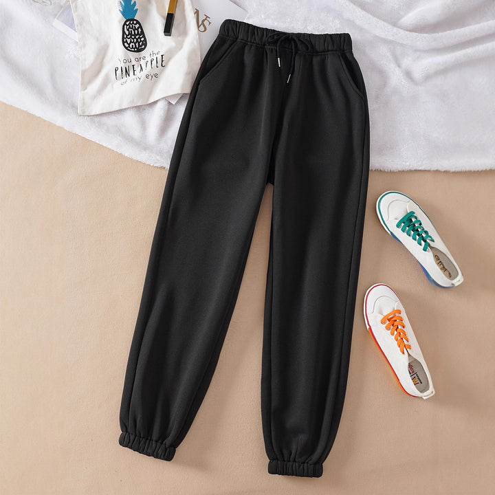 Women's high-cut joggers made of soft fleece cotton blend with elastic waistband, drawstring, and side pockets Mune Fashion