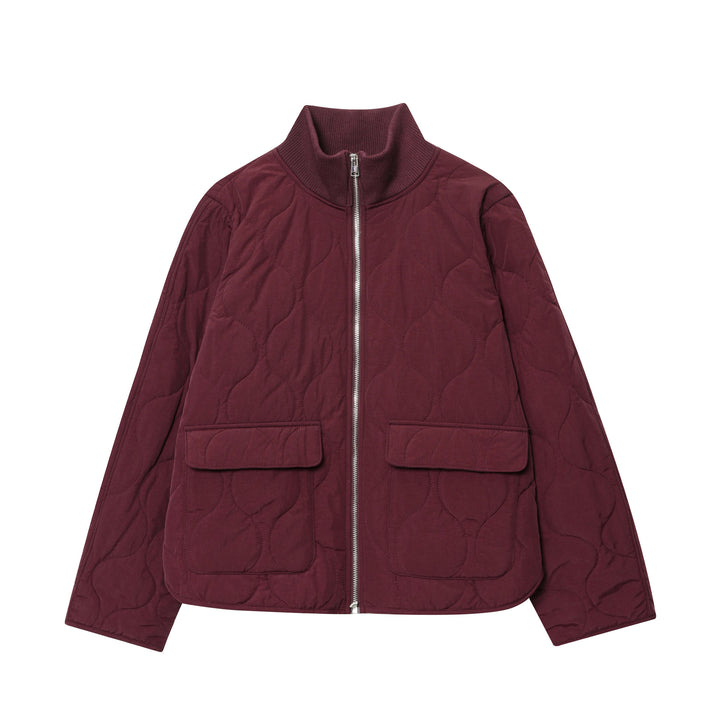 Women's lightweight quilted jacket with round quilting, high ribbed collar, and patch flap pockets Mune Fashion