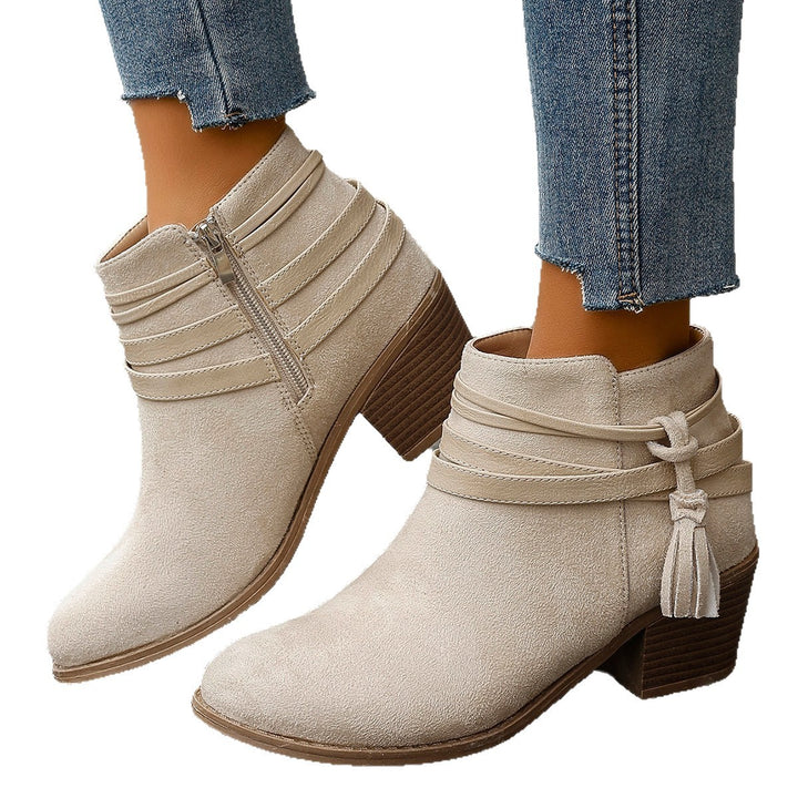 Ladies faux suede ankle boots with decorative straps, tassels, and side zipper Mune Fashion