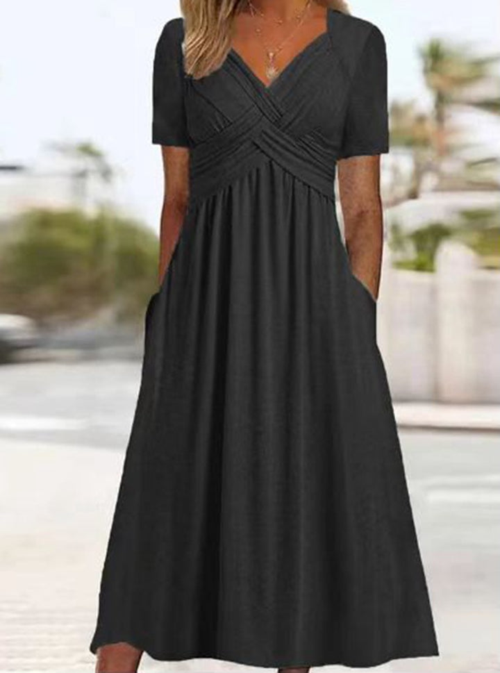 Women's airy midi dress with V-neck, wrap look, empire waist, and pockets Mune Fashion