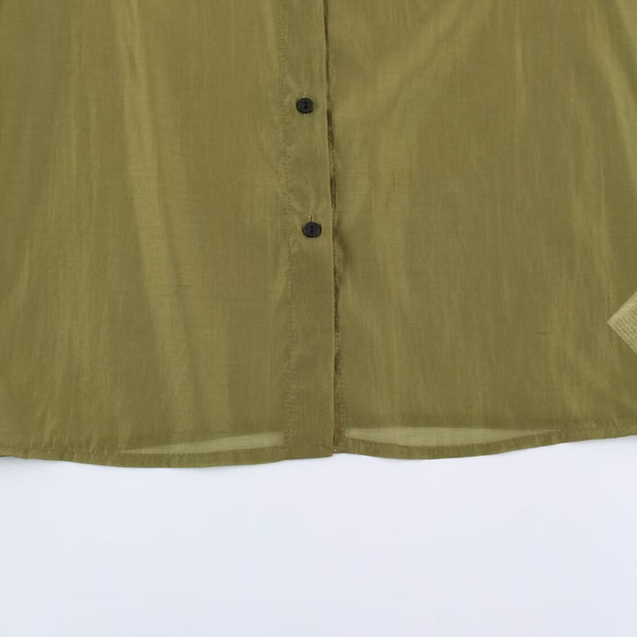 Women's silk effect blouse with voluminous sleeves, layered ruffles, and smocked cuffs