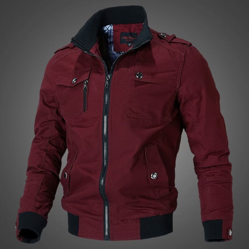 Men's tailored canvas bomber jacket with stand-up collar, zip front, shoulder patches, and functional pockets