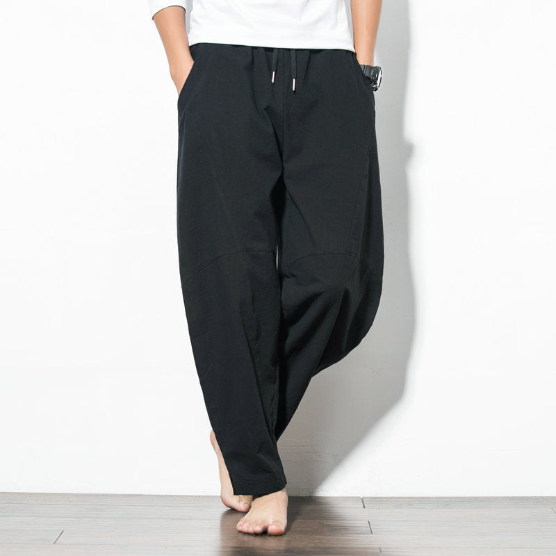 Men's loose harem pants made of cotton blend with elastic waistband, drawstring and side pockets Mune Fashion