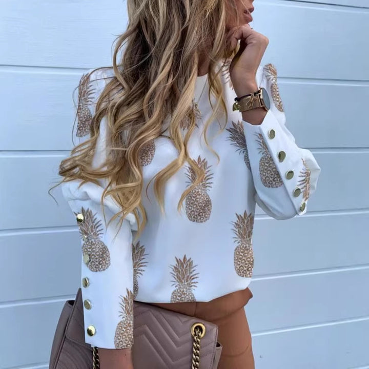 Women round neck blouse made of viscose blend with pineapple print and golden decorative button cuffs Mune Fashion