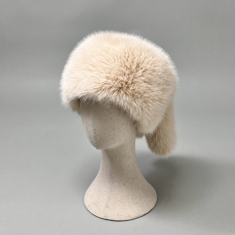 Women’s plush faux fur trapper hat with earflaps and decorative tail Mune Fashion