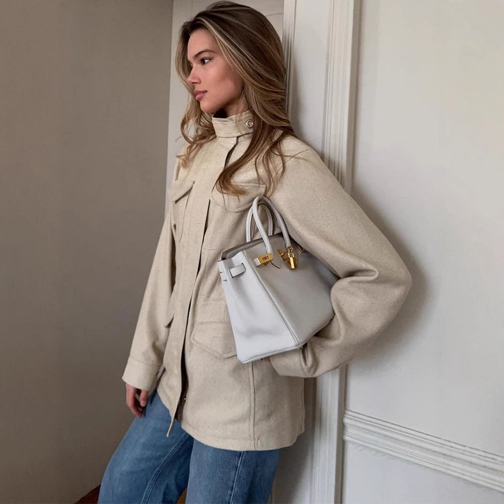 Women's oversized field jacket made of wool blend with stand-up collar and applied flap pockets