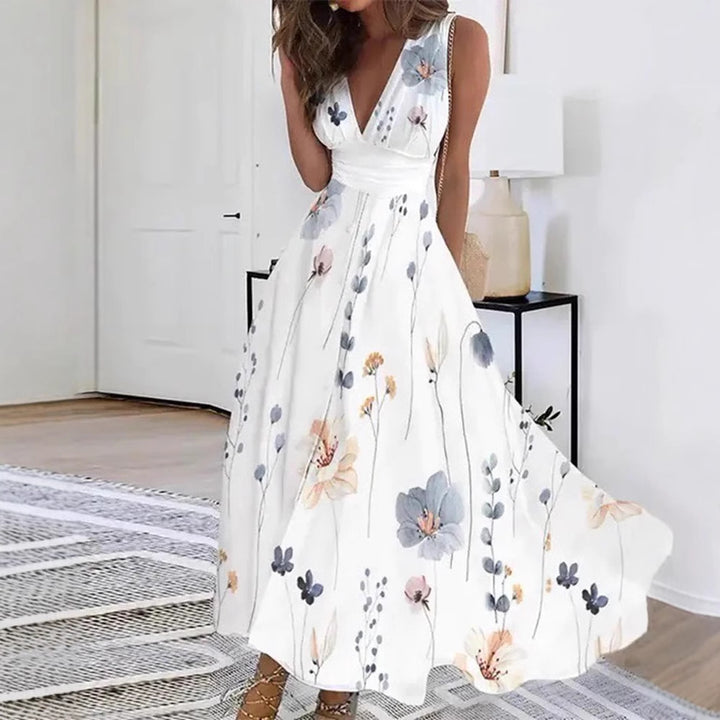 Women's flared midi dress with deep V-neck, empire waist and delicate floral print Mune Fashion