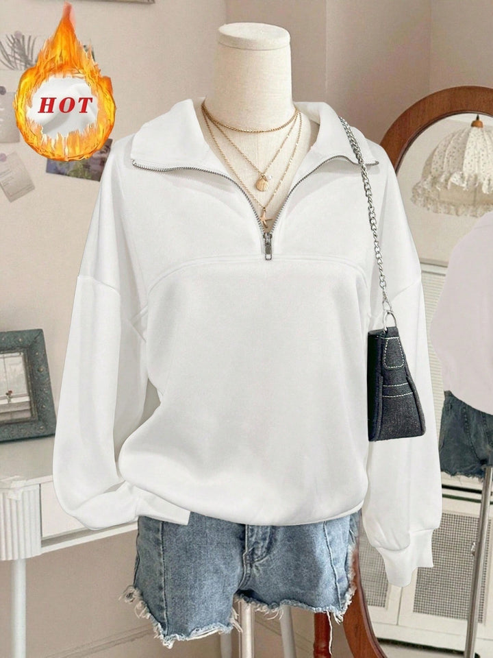 Women's oversized sweatshirt with half zipper, high collar and balloon sleeves Mune Fashion