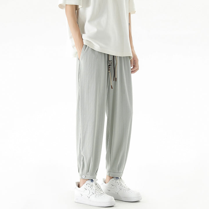 Men's loose-fitting leisure pants with drawstring, fine ribbed structure, and buttoned cuffs Mune Fashion