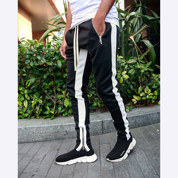 Men's narrow jogging pants with side contrast stripe, drawstring and ankle zipper Mune Fashion