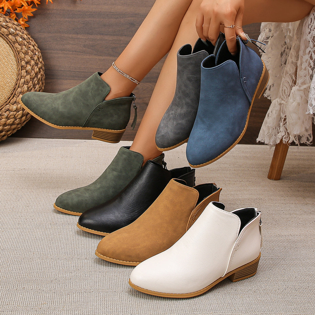 Women’s ankle boots with heel zipper, side cut-out and low block heel Mune Fashion