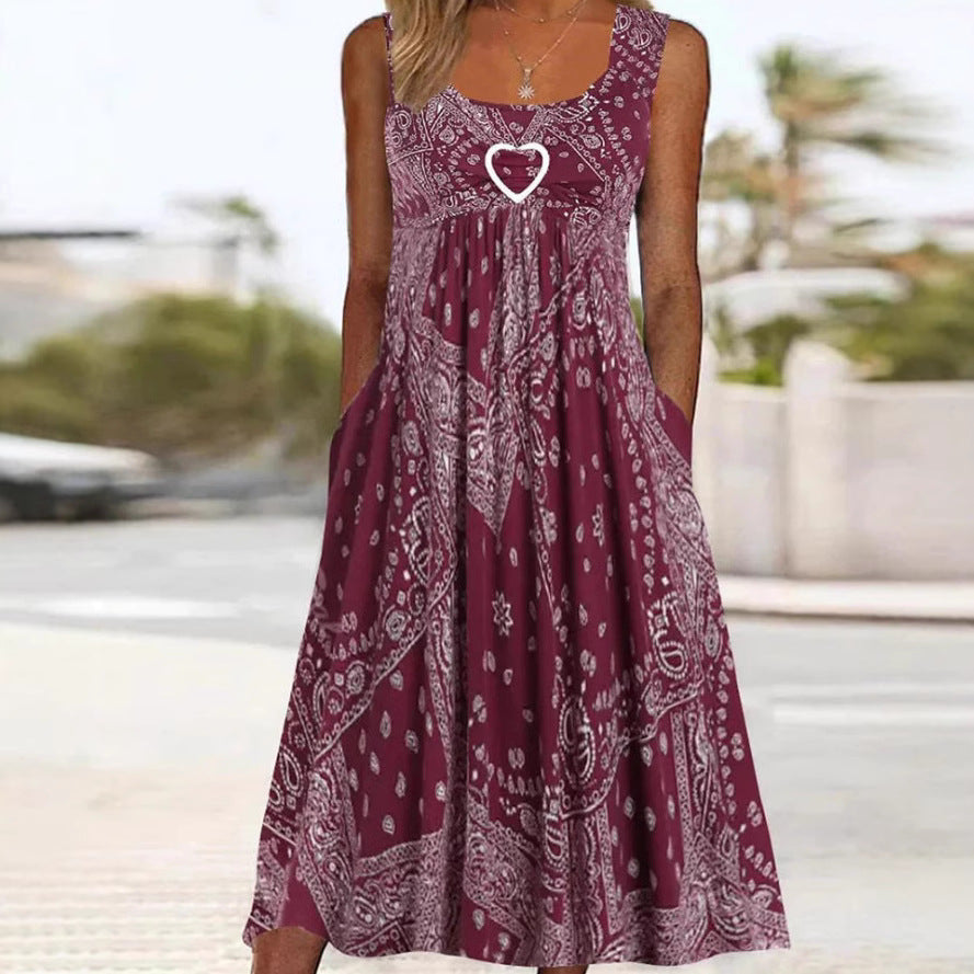 Women's airy maxi dress with paisley bandana print, gathered empire waist and practical side pockets Mune Fashion