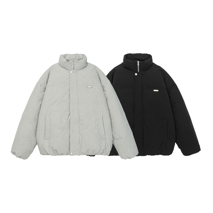 Women short cut oversized quilted jacket with high stand-up collar and concealed zipper Mune Fashion