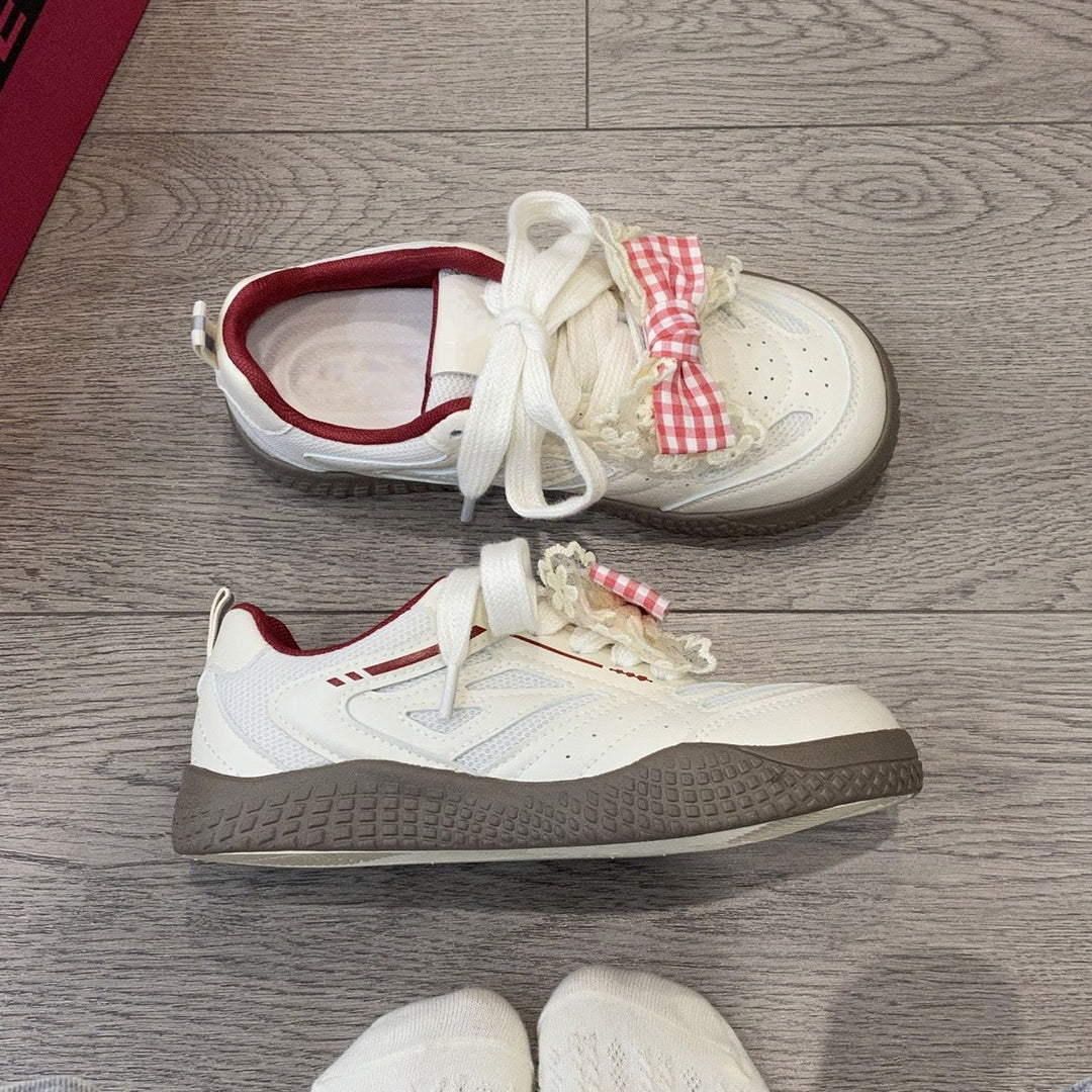 Women's sneakers with playful bow design by Mune Fashion