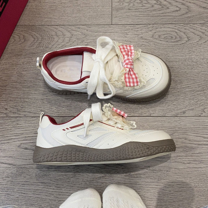 Women's sneakers with playful bow design by Mune Fashion