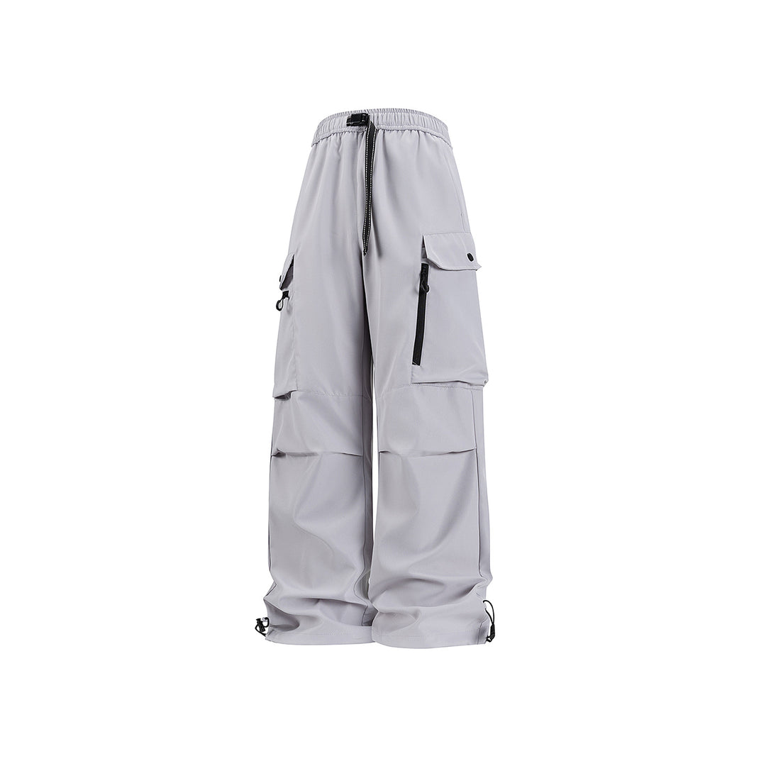 Unisex Wide technical cargo pants with multi-function pockets, drawstring and adjustable leg hems Drune