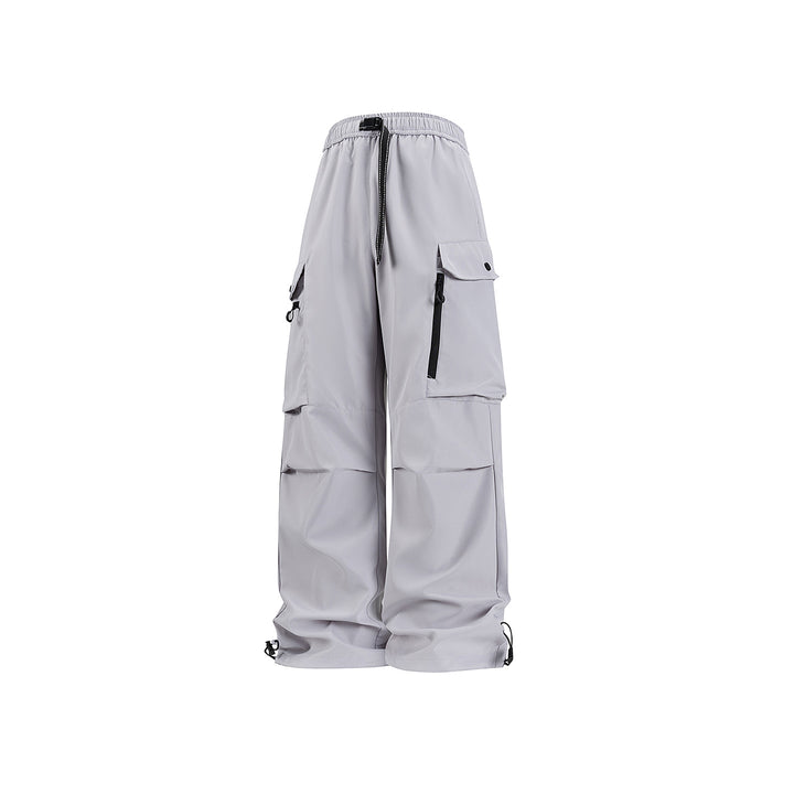 Unisex Wide technical cargo pants with multi-function pockets, drawstring and adjustable leg hems Drune