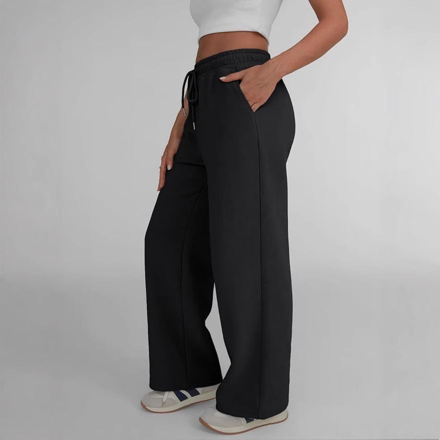 Women's wide lounge pants with high elastic waistband, adjustable drawstring and flowing palazzo silhouette Mune Fashion