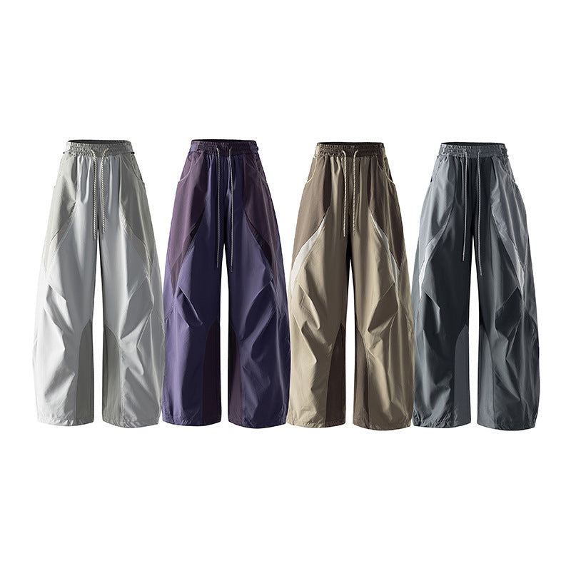 Women's wide technical balloon pants with drawstring waistband and insert panels