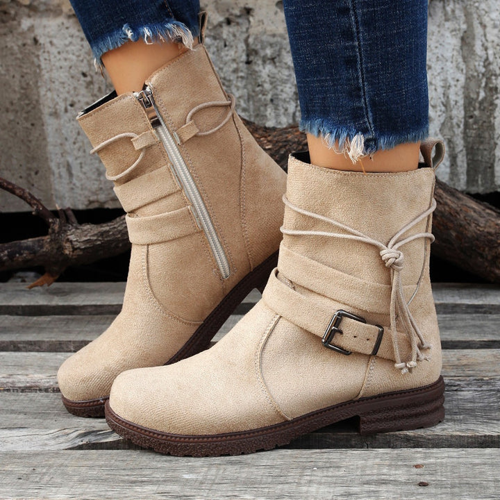 Women's ankle boots made of suede effect with a side zipper, decorative wrap strap, and sturdy profiled sole Mune Fashion