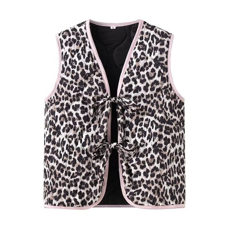 Ladies nan lightweight quilted reversible vest with leopard print, contrast piping, and double bow closure Mune Fashion