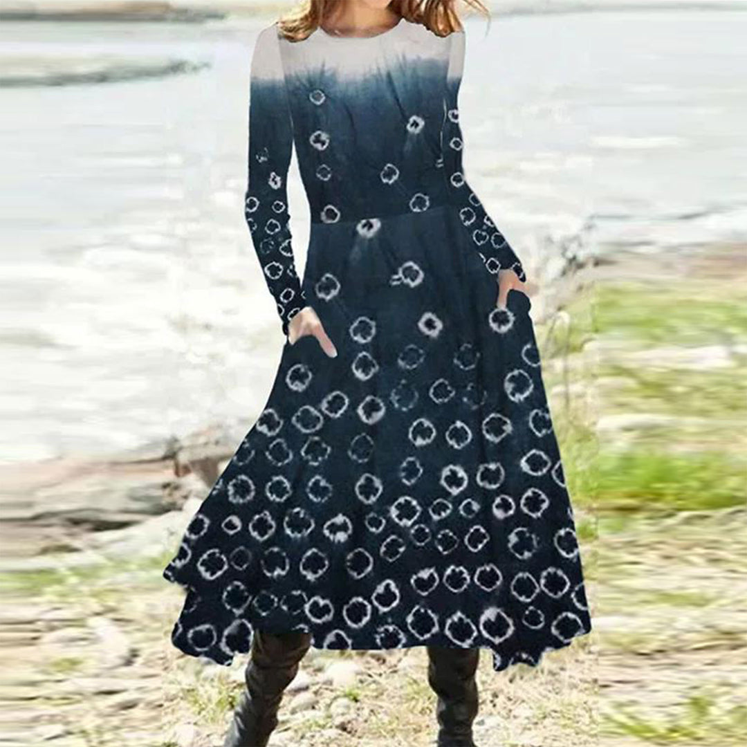 Women's flowing maxi dress with tie-dye circle pattern, round neckline, waist seam, and side pockets Mune Fashion