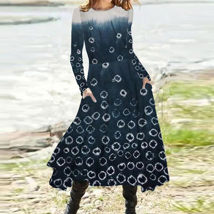Women's flowing maxi dress with tie-dye circle pattern, round neckline, waist seam, and side pockets Mune Fashion