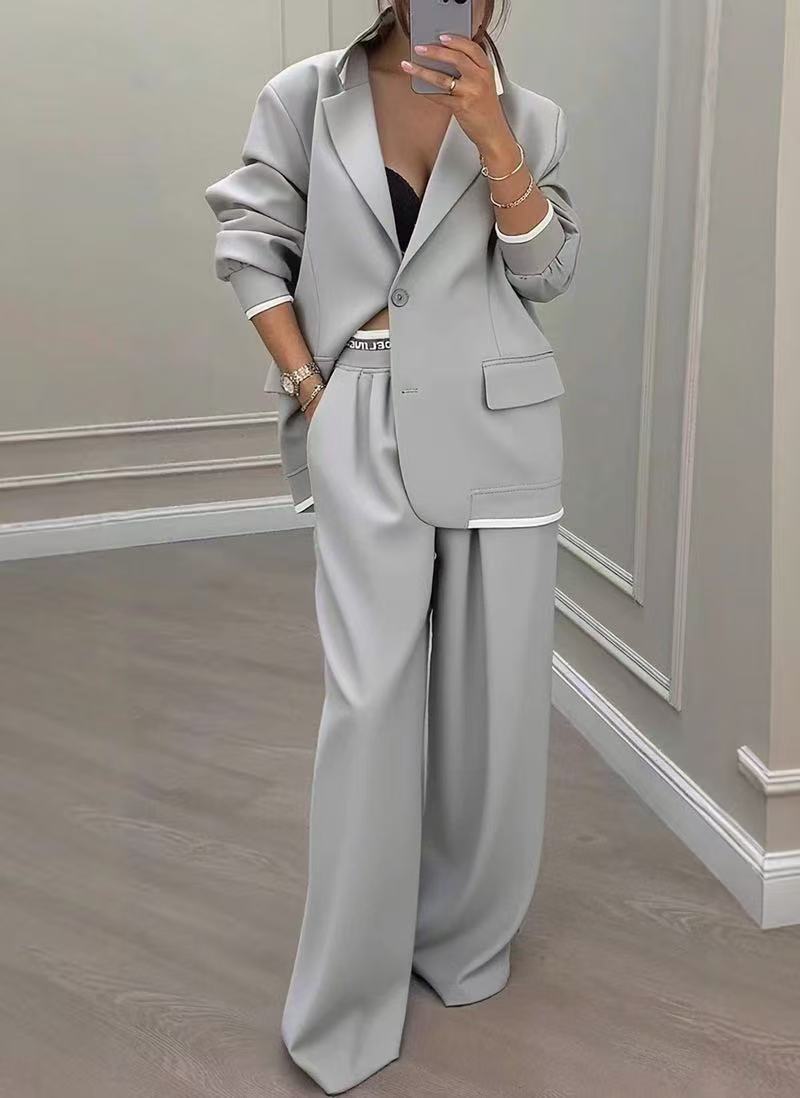 Women Oversize Tailoring Set with contrast piping, single-button blazer and high-cut wide-leg pants Mune Fashion