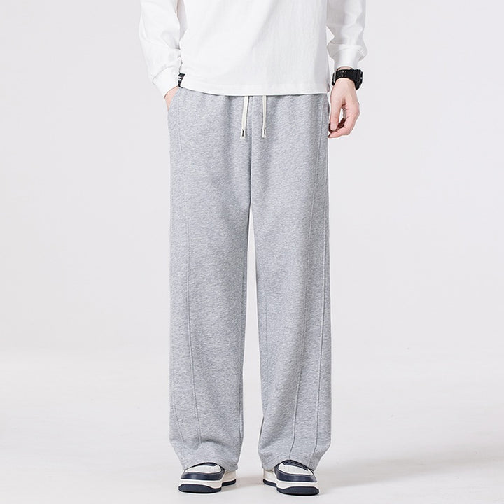 Men's leisure joggers in oversized cut with elastic drawstring waistband & distinctive side seam Mune Fashion