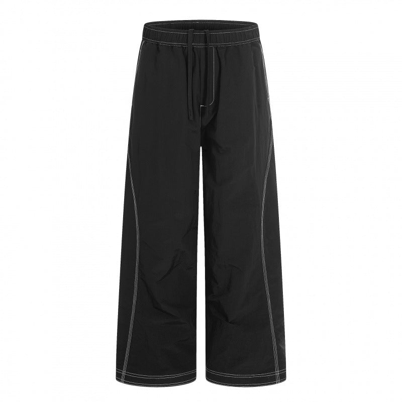 Women's wide pants with elastic waistband, drawstring and contrasting decorative seams Mune Fashion