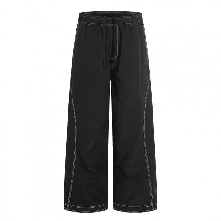 Women's wide pants with elastic waistband, drawstring and contrasting decorative seams Mune Fashion